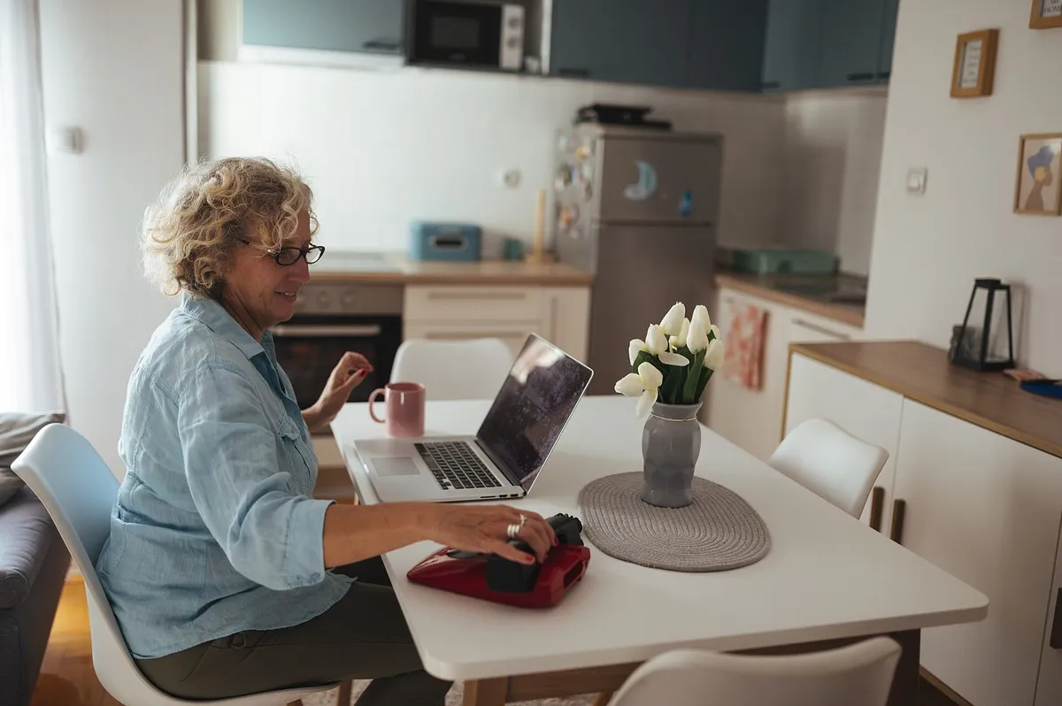 senior using laptop