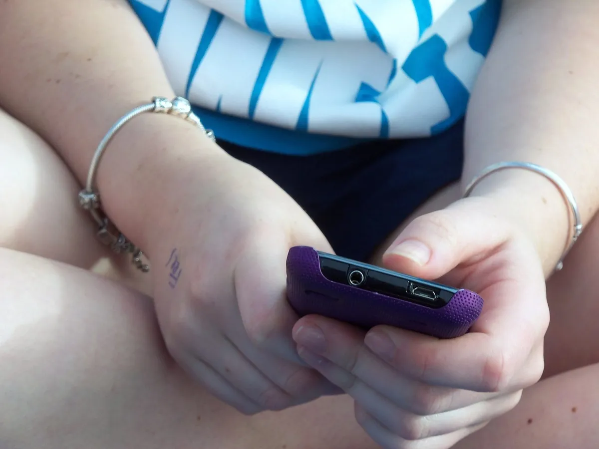 teenager phone scrolling
